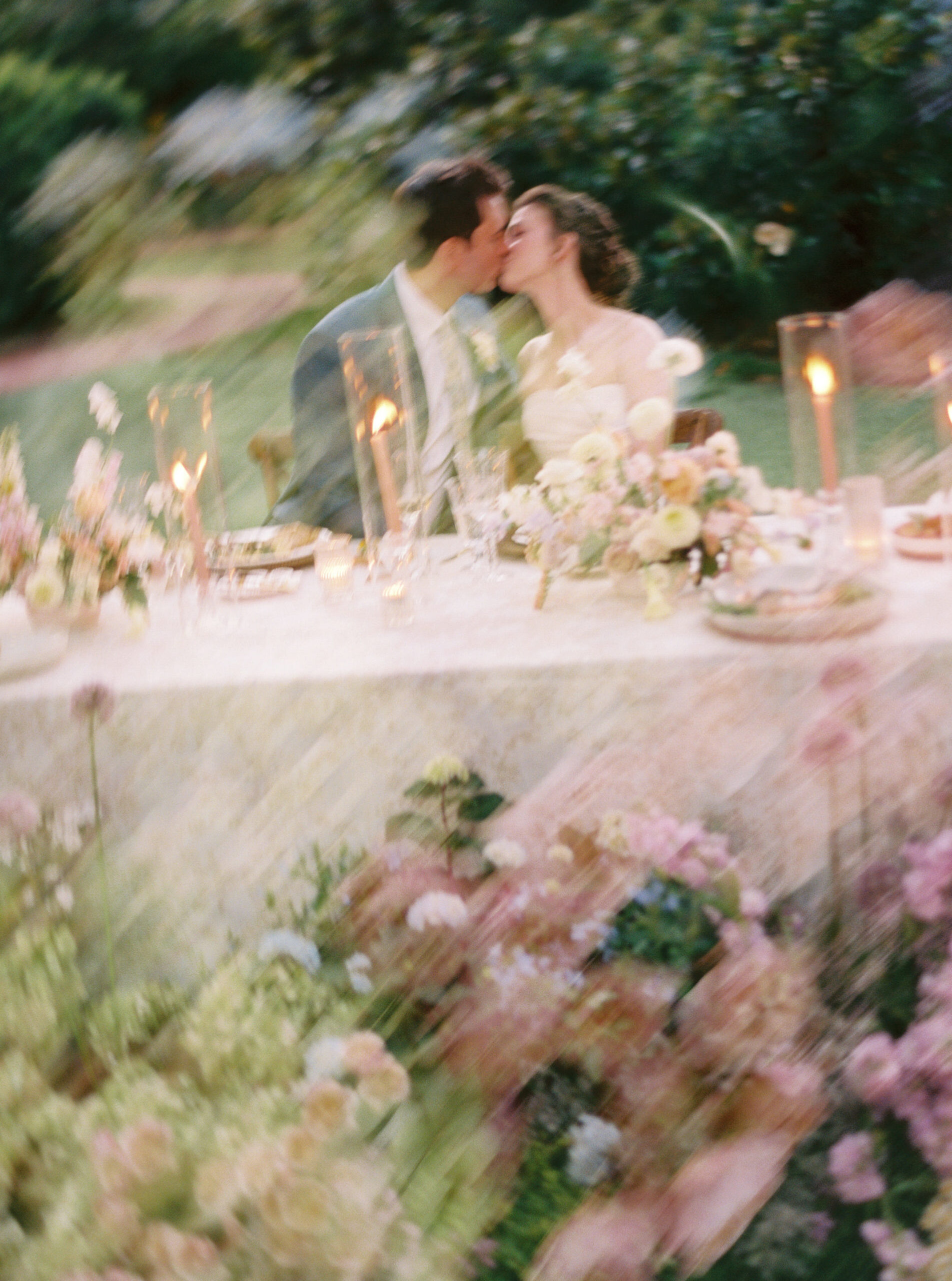 an artful double exposure of a couple kissing during their spring monet-inspired wedding at Woodbine Mansion